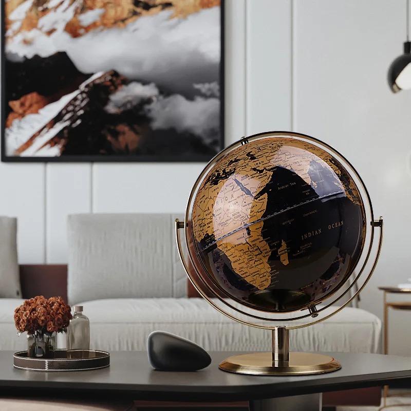 World globe with metal stand and black ocean
